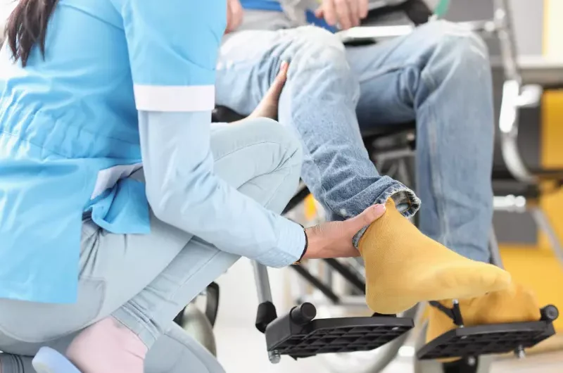 Nurse helping person in wheelchair